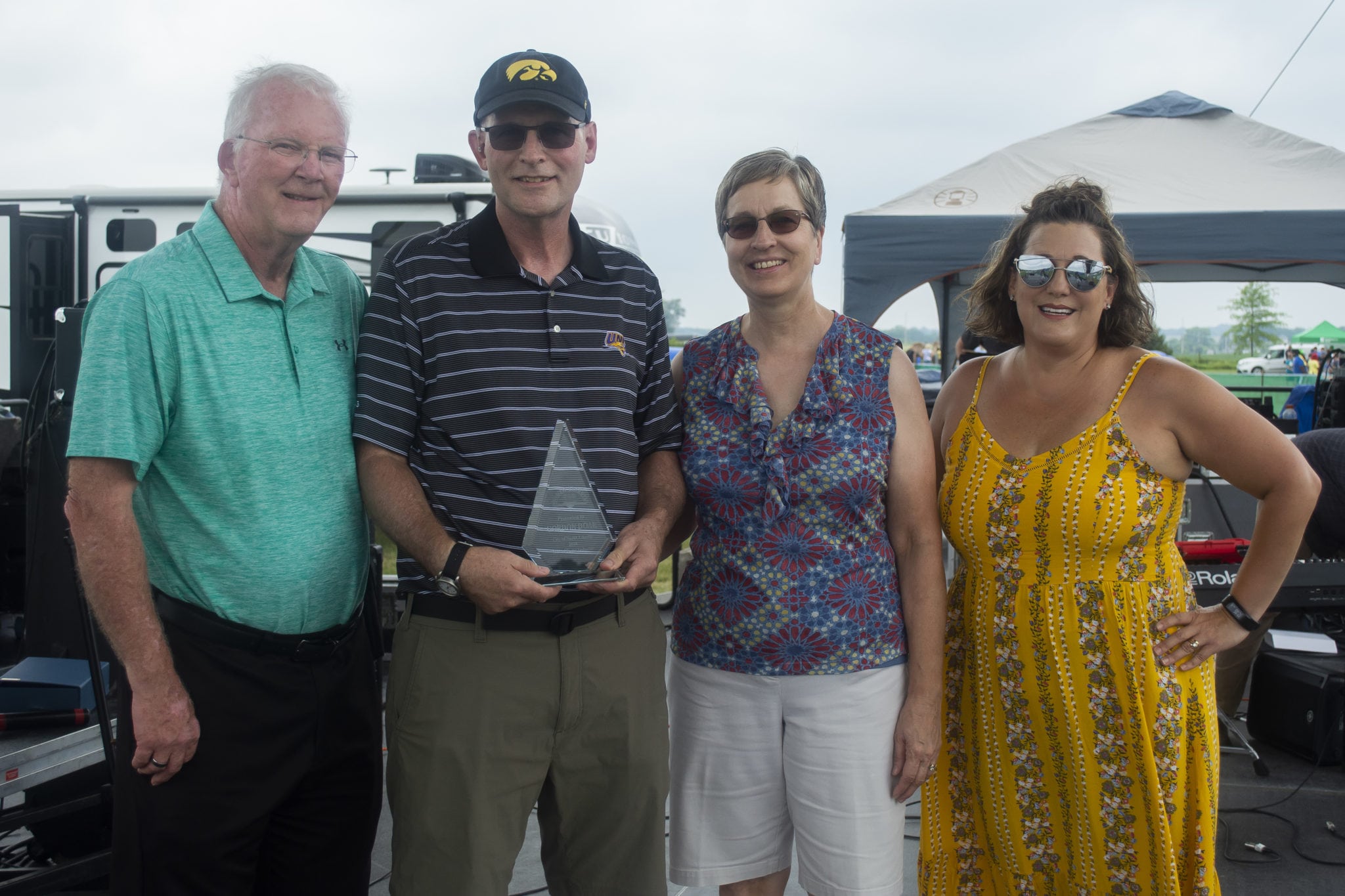 Gordon Doak receives his recognition for good work in North Liberty along side his wife, the mayor and city clerk.