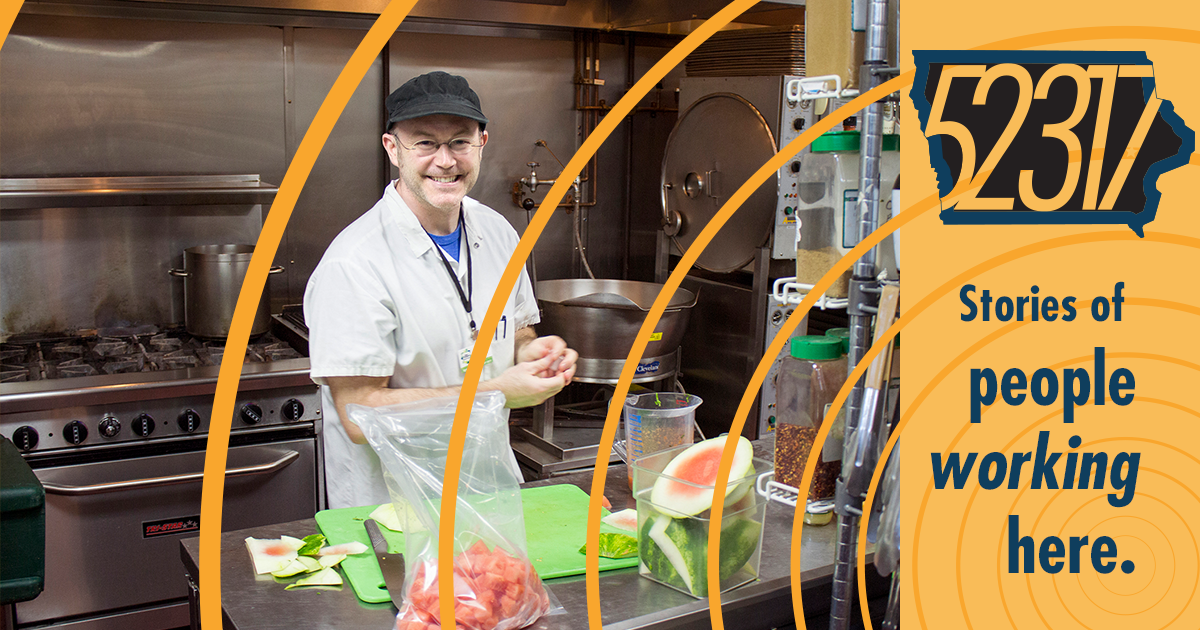 man in commercial kitchen cooking