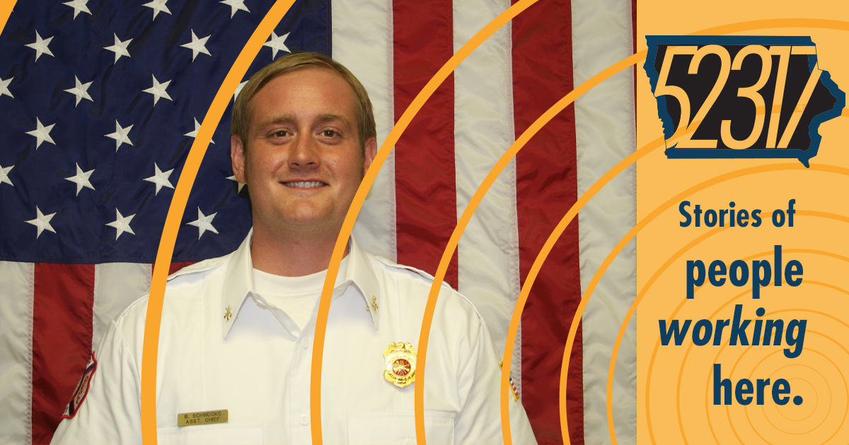 fire fighter man in front of united states flag