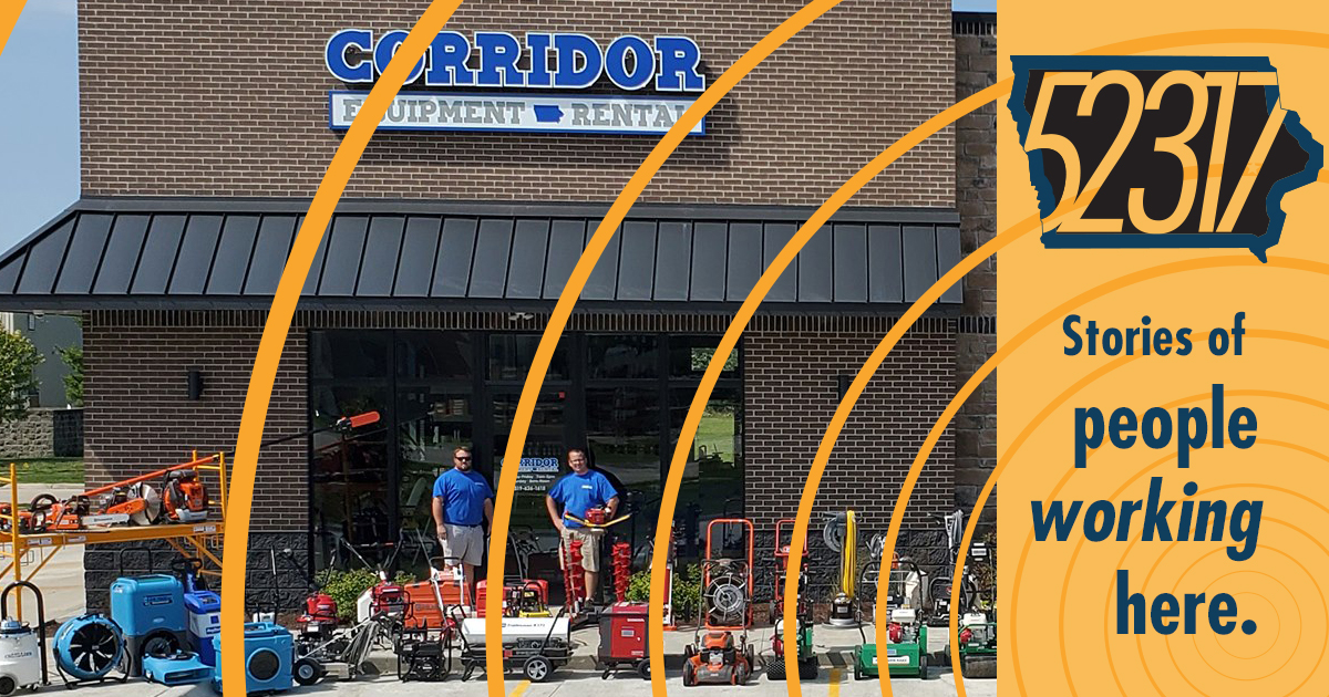 Corey and Kelly standing in front of their business Corridor Equipment Rental