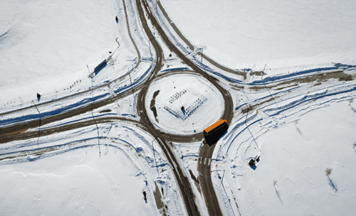 A snowy roundabout from above.