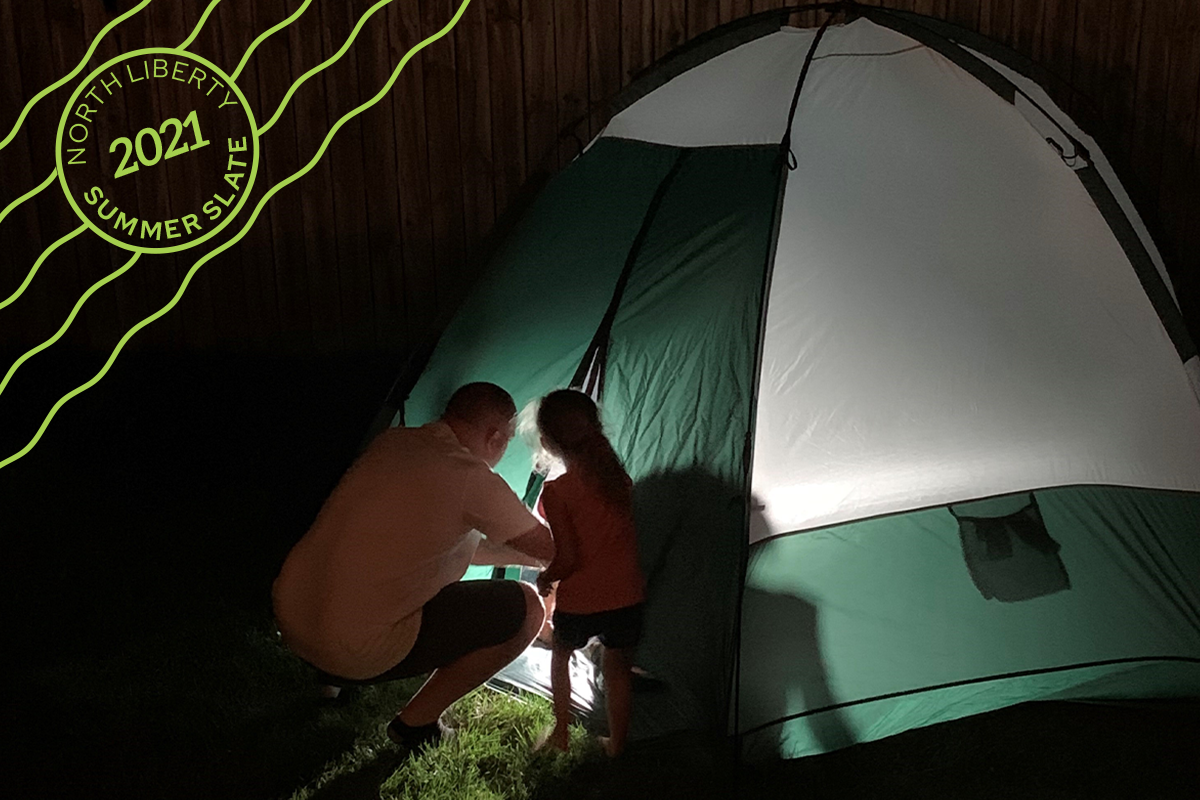 daughter and dad next to tent