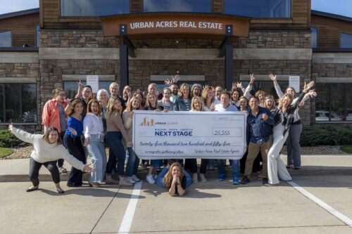 Urban Acres agents with large check
