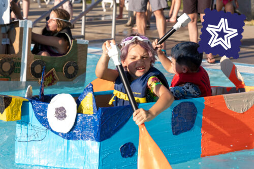 kids on cardboard boat