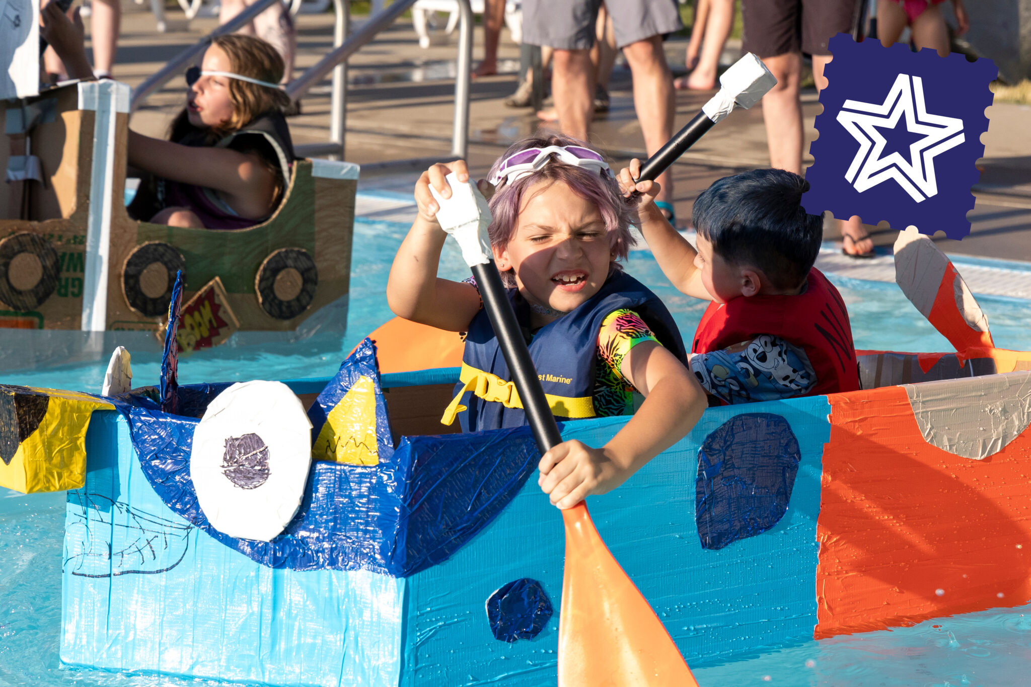 kids on cardboard boat