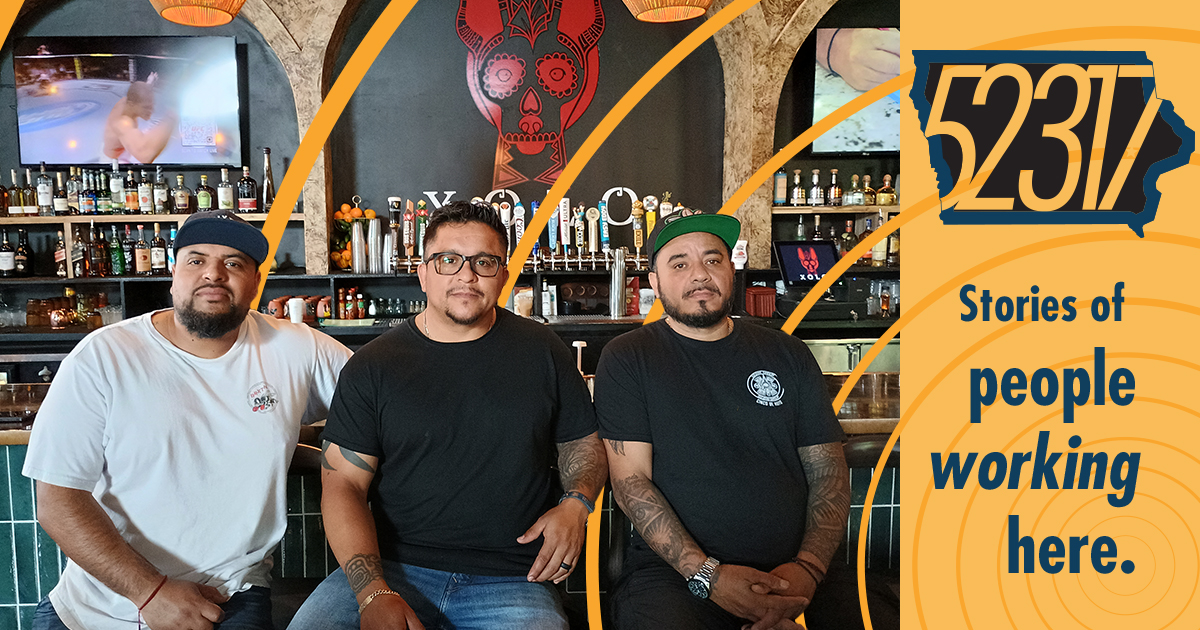 ozzy, raul and ariel, from ozzar group llc, partners and restaurateurs sitting in front of the bar at xolo, their newest venture in north liberty